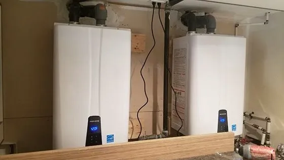Two tankless water heaters installed side by side